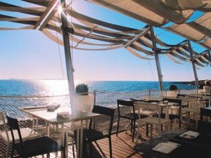 Beach restaurant in Ibiza Spain and sunset, outdoor dining no people